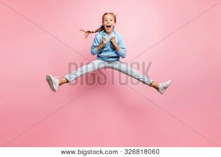 Full Length Photo Of Pretty Little Lady Jumping High Excited Summer Mood Listening Modern Earflaps P