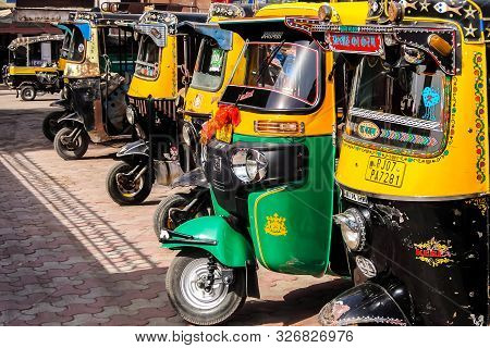 Bikaner, India - Circa March 2018. Rickshaw Cab At The Parking Lot Near The Bikaner Railway Station.
