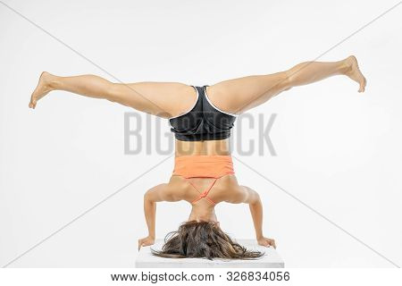 Cute Girl Doing Yoga On White Background Isolated.