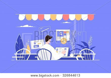 Man Working In Fashion Cafe With Tablet