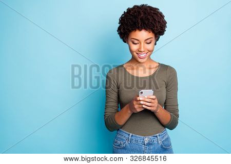 Portrait Of Positive Cheerful Focused Afro American Girl Use Her Cellphone Type Message Read Feednew