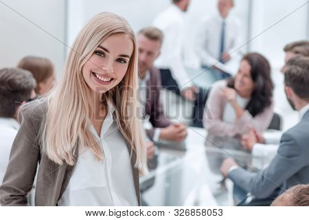 close up. smiling young employee standing in the office