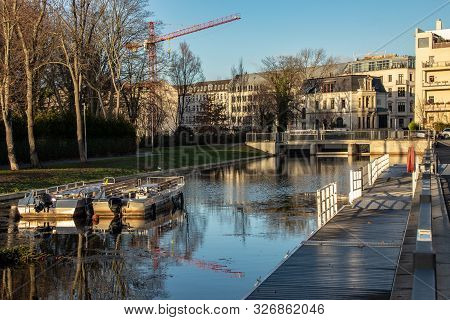 Water City Leipzig-future City Harbor With Persons Boats, Lock
, Houses And Construction Site In The