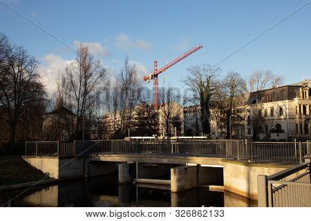 Water City Leipzig-future City Harbor With Persons Boats, Lock
, Houses And Construction Site In The