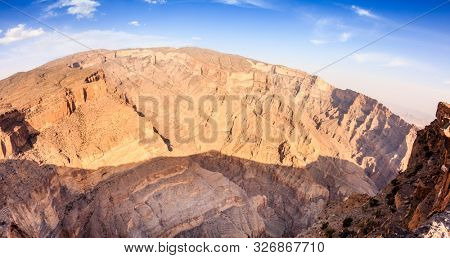 Wide angle view of Wadi Ghul aka Grand Canyon of Arabia in Jebel Shams, Oman