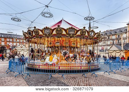 Madrid, Spain - December 20, 2010: People Have Fun In Christmas Time On The Carrousell For Children 