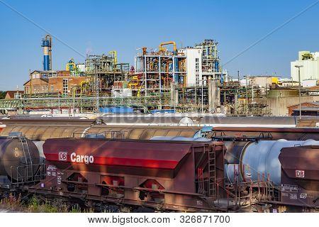 Frankfurt, Germany - June 27, 2011: Industry Park In Frankfurt Hoechst With Tank And Chimney Under B