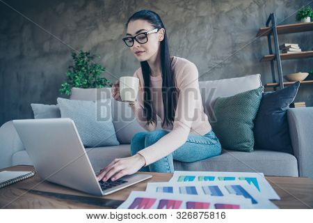 Photo Of Pretty Lady With Hot Beverage Texting Notebook Checking Corporate Feednews Sitting Comforta