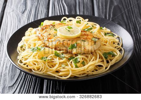 Roasted Breaded Chicken Francaise With A Side Dish Of Spaghetti Close-up On A Plate. Horizontal