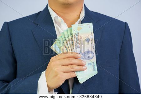Money In Vietnam Hold On Hand Business Man Wearing A Blue Suit (socialist Republic Of Vietnam), Dong