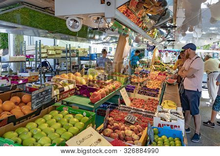 Selestat, France - June 23, 2018: People Buy Fresh Vegetables From The Alsace Region At The Weekly M