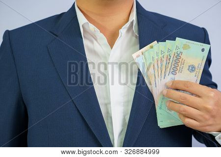 Money In Vietnam Hold On Hand Business Man Wearing A Blue Suit (socialist Republic Of Vietnam), Dong