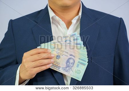 Money In Vietnam Hold On Hand Business Man Wearing A Blue Suit (socialist Republic Of Vietnam), Dong