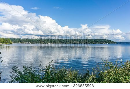Billowing Clouds Hover Over Mercer Island In Washington State.