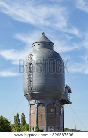 Neunkirchen, Germany - Aug 5, 2018: Old Iron Works Monuments In Neunkirchen From The Late 20th Centu