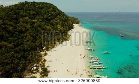 Aerial Seascape: Tropical Beach With Palm Trees And Turquoise Waters Of The Coral Reef, From Above, 