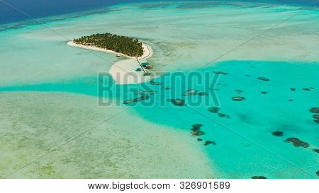 Tropical Island Among Coral Reefs With A White Beach And Blue Atoll Water. Onok Island, Balabac, Phi