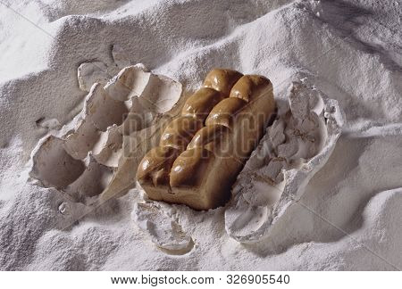 In A Bed Of Flour A Beautiful Loaf Of Bread Comes Out Of Its Shell