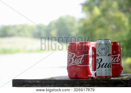 Sumy, Ukraine - August 10, 2019: Budweiser Bud Beer Can On Old Wooden Table Outdoors At The River An