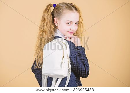 Schoolgirl Ponytails Hairstyle With Small Backpack. Carrying Things In Backpack. Learn How Fit Backp