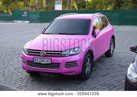 Kharkov, Ukraine - September 24, 2019: Volkswagen Touareg Hybrid Nf In Magenta Purple Color On Parki