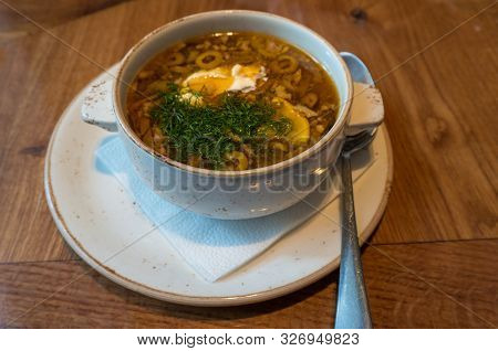Borscht Or Borsht Soup In A Rustic Bowl Garnished With Sour Cream And Dill