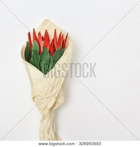 Celebration Background With Bouquet Of Flowers In Paper Packaging Beautiful Flower Protea, Big Exoti