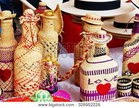 Wicker Souvenirs: Baskets, Dolls, Bottles, Hats Made From Toquilla Straw, Vegetable Fiber And Painte