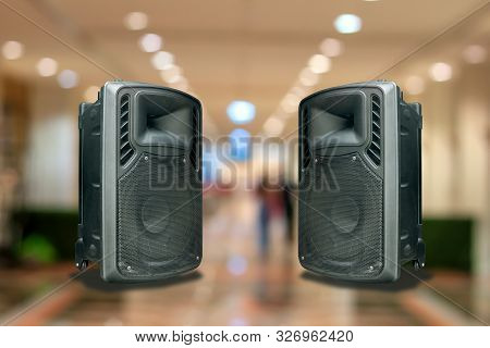 Speakers With Built-in Amplifiers. With The Lights And The Concert Colors As A Backdrop
