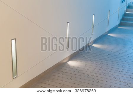 Stone Staircase And Wall Lamps. Decorative Lamps In Modern Spa Center.