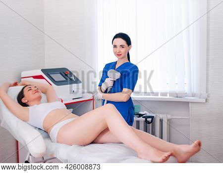 A Black-haired Beautiful Cosmetologist Girl Does Laser Body Hair Removal, A Businesswoman In White U