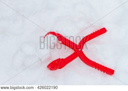 Devices For Making Snowballs From Melting Snow During The Thaw For Children's Games In Winter.