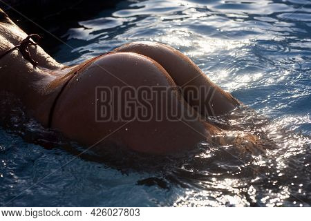 Bikini Girl With Perfect Body In Water. Female Wet Buttock With Drops. Natural Butt, Fit Sporty Crop
