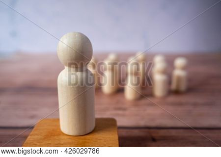 Wooden Figures Standing Out From Crowd.depicts The Ability Of Individual To Influence And Lead Follo