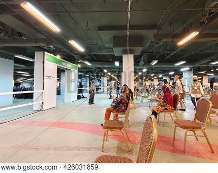 Selangor, Malaysia - July 6,2021 : Public People Can Seen Waiting Patiently In The Hall For Their Tu