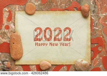 Text 2022 Happy New Year On Aged Paper. Abstract Liquid Acrylic Background In Orange, Brown Earth Co