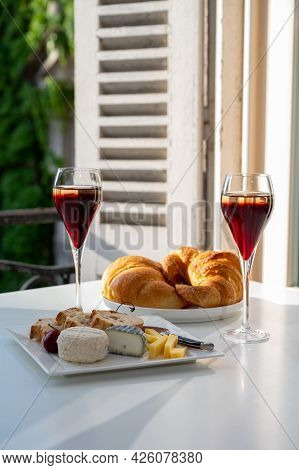 Drinking Of Kir Royal,  French Aperitif Cocktail Made  From Creme De Cassis Topped With Champagne, T