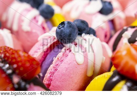 Traditional French Macaroons With Bluebarry And Strawberry. Colourful And Delicious Dessert With Cho