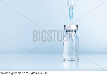 Close-up Of Syringe And Injection Vial Efficient For Flu, Coronavirus, Covid-19 Vaccine Disease