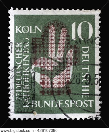 ZAGREB, CROATIA - AUGUST 29, 2014: Stamp printed in Germany, shows a hand raised to the oath in front of the floor plan of the Cologne Cathedral, 77th German Catholic Day in Cologne, circa 1956