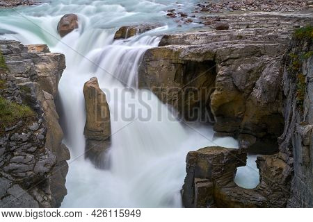 Jasper National Park Sunwapta Falls Alberta. Water Pours Over Sunwapta Falls. Jasper National Park. 
