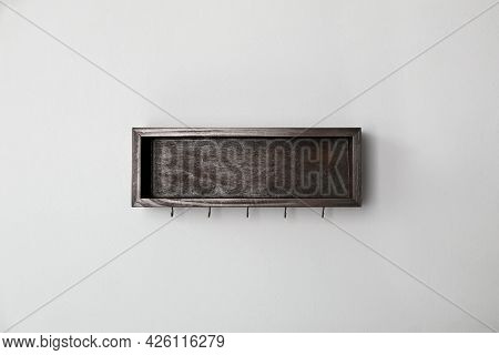 Wooden Hanger For Keys On Light Grey Wall