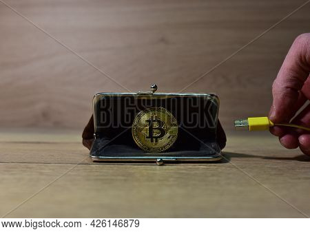 Usb Cable Connects To Crypto Wallet. Crypto And Bitcoin Wallet Concept. Ryptocurrency Trading Exchan