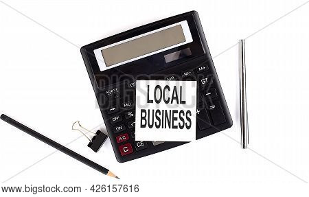 Local Business Text On Sticker On Calculator With Pen,pencil On White Background