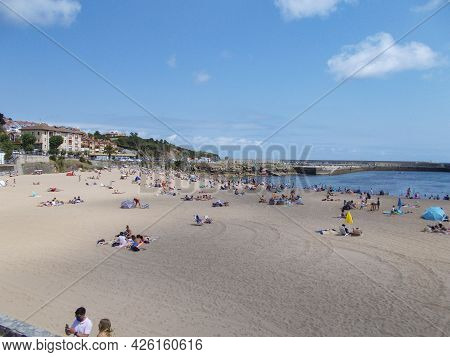 Luanco, Spain - August 7. View Of The Port And The Church Of The Small Town Of Luanco In Asturias, S