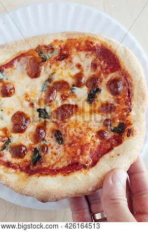 A Close-up Of A Mini Pizza In A Disposable Dish. Top View Of Takeaway Food In Fast Food Cafe. The Ph