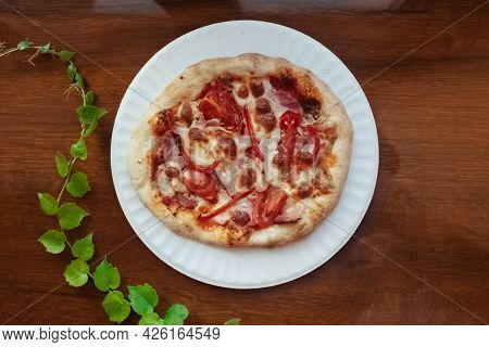 A Close-up Of A Mini Pizza In A Disposable Dish. Top View Of Takeaway Food In Fast Food Cafe. The Ph
