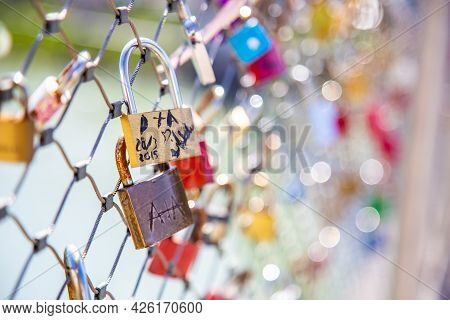 Salzburg, Austria - 9 April 2015 - Love Padlocks Hang On Chainlink Fence Of A Bridge In Salzburg, Au