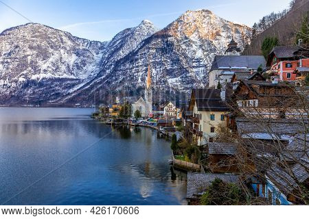 View Of The Famous Hallstatt Town At The Lake With Mountain Ranges In Background On An Evening Of A 