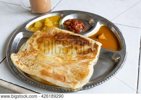 Roti Planta Is Popular Breakfast In Malaysia. It Is Roti Canai With Added Margarine.